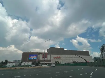 an empty parking lot in front of a large building at Gentry Manor Manila Bay Okada Complex MOA&Airport WiFi Netflix 8K in Manila