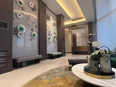 a lobby with couches and a table in a building at Gentry Manor Manila Bay Okada Complex MOA&Airport WiFi Netflix 8K in Manila