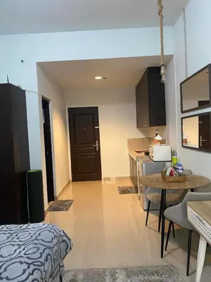 a room with a kitchen and a dining room at Nature Inspired Affordable Rooms in F RESIDENCE near Edsa Shaw Pasig Megamall Shangrila and MRT in Manila