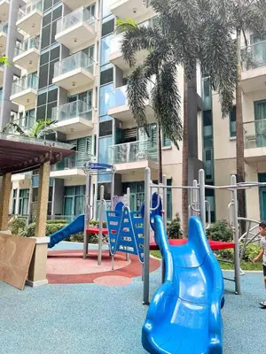 a playground in front of a apartment building at Across NAIA terminal 3 in Manila