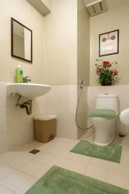 a bathroom with a toilet and a sink at La Verti Residences Unit 1420 I Skyline Views & Luxe Stay Near MOA in Manila