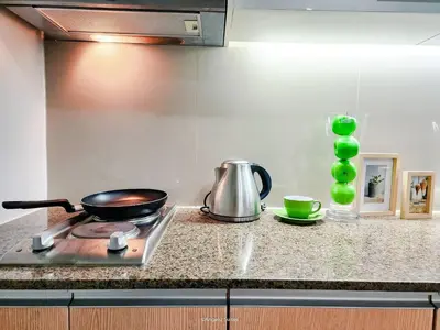 a frying pan on a stove in a kitchen at LARGE One Bedroom Unit In Uptown BGC in Manila