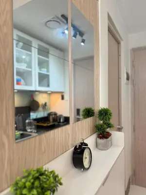 a clock sitting on a counter in a kitchen at CASA Salcedo - Field Residences in Manila