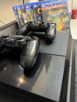 two video game controllers sitting on top of a box at CASA Salcedo - Field Residences in Manila