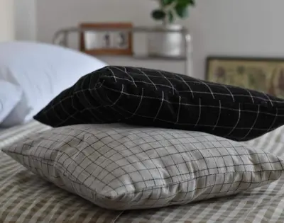 two pillows sitting on top of a bed at Kael Studio in Manila