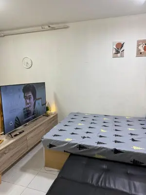 a bedroom with a bed and a flat screen tv at At Home in Santa Rosa in Santa Rosa