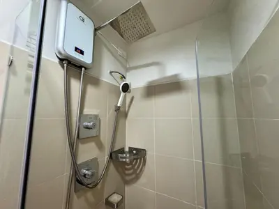 a shower in a bathroom with a glass door at 1230 Flor Suite Shore 3 Residences near SM MOA by PrimeStay in Manila