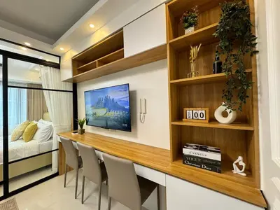 a room with a bar with chairs and a bed at 1230 Flor Suite Shore 3 Residences near SM MOA by PrimeStay in Manila