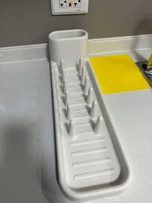 a white computer keyboard sitting on top of a counter at Eve's Den in Manila