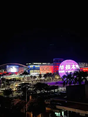 a city lit up at night with a large pink ball at Staycation At Shore 2 Residences Tower 2 in Manila