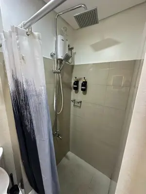 a shower with a shower curtain in a bathroom at Staycation At Shore 2 Residences Tower 2 in Manila