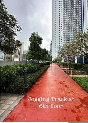a red path in the middle of a city at Luxury in the Makati Skyline in Manila