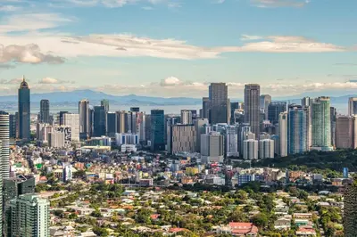 an aerial view of a city with tall buildings at StayHere 3BR Penthouse Knightsbridge Makati in Manila