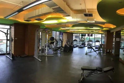 a gym with a lot of exercise equipment in it at StayHere 3BR Penthouse Knightsbridge Makati in Manila