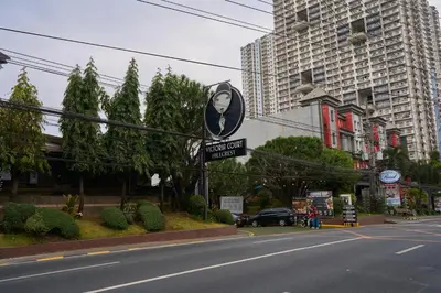 a street sign on the side of a city street at Victoria Court Hillcrest in Manila