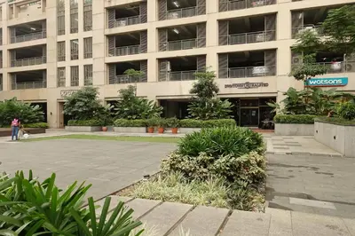 a large building with plants in front of it at Luxury Condo at Forbeswood Parklane The Fort BGC in Manila