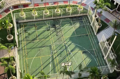 an overhead view of a swimming pool with a roller coaster at Extremeli Suites in Manila