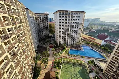 an aerial view of a city with tall buildings at Extremeli Suites in Manila