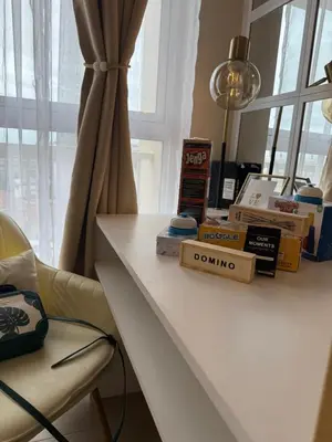 a white table with boxes on it next to a window at Venice Staycation Cozy Glimpse of Grand Canal View Retreat in Manila