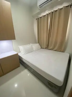 a small bed in a small room with a window at Happy Haven At Shore 3 Moa Pasay in Manila