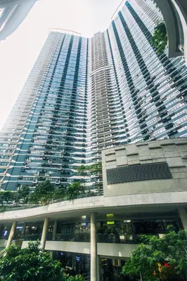 a large tall building with a lot of windows at Beauty Makati Penthouse 4 room Family Condo in Manila