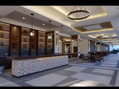 a lobby of a hotel with a bar and chairs at Near NAIA 3 Condo in Manila