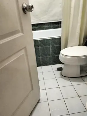 a bathroom with a toilet and a bath tub at Chic Haven in Manila