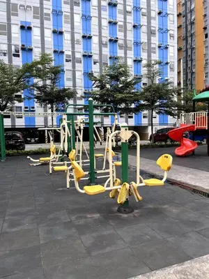 a group of play equipment on a sidewalk at Family Friendly Stay UrbanDeca in Manila