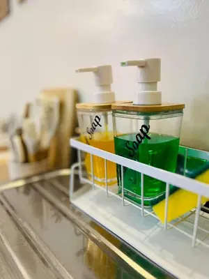 two bottles of cleaning products sitting on a shelf at Fablo Staycation By Enchanted Kingdom in Santa Rosa