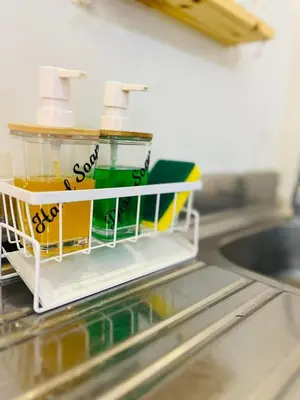 a toy dish rack on a counter in a kitchen at Fablo Getaway Staycation Beside Enchanted Kingdom in Santa Rosa