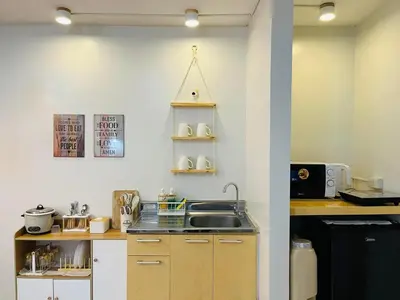 a kitchen with a sink and a counter top at Fablo Getaway Staycation Beside Enchanted Kingdom in Santa Rosa