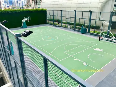 a tennis court on top of a building at Acqua Private Residences -IGUAZU Tower 16th flr - Mandaluyong in Manila