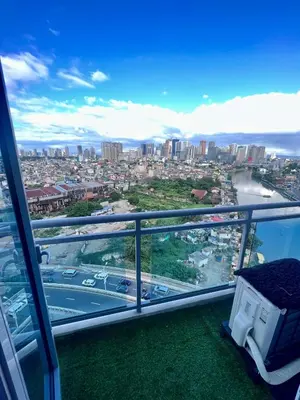 a view of a city from the top of a building at Acqua Private Residences -IGUAZU Tower 16th flr - Mandaluyong in Manila