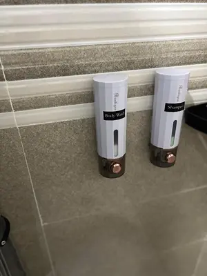 two electric toothbrushes sitting on a counter in a bathroom at Modern Studio near LRT, MOA & Star City in Pasay in Manila