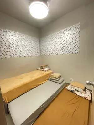a room with two bunk beds in it at LJ's escape 2BR COAST Residences in Manila