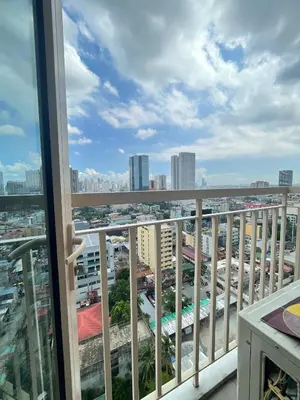 a balcony with a view of a city at LJ's escape 2BR COAST Residences in Manila