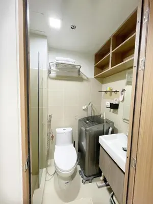 a bathroom with a toilet and a sink at 212 Budget Condo at Shore 3 The Dwelling place in Manila