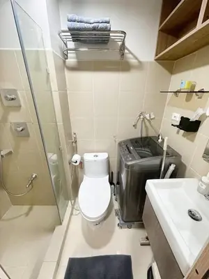 a bathroom with a toilet and a shower and a sink at 212 Budget Condo at Shore 3 The Dwelling place in Manila