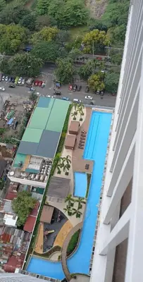 an overhead view of a pool at a resort at Staycation at a Breeze 01 in Manila