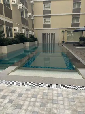 a swimming pool in the middle of a building at The Crystal Cove Cabin in Puting Kahoy