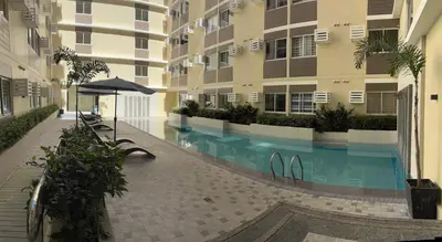 a swimming pool in the middle of a building at The Crystal Cove Cabin in Puting Kahoy