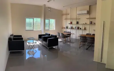 a living room with chairs and tables in a room at The Crystal Cove Cabin in Puting Kahoy