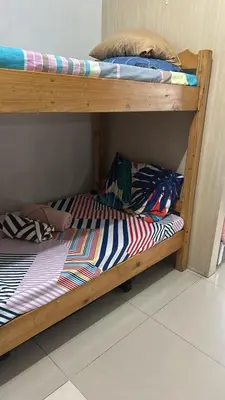 two bunk beds with towels on the bottom bunk at Chay place sea residence in Manila