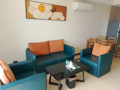 a waiting room with two chairs and a table at Hotel S in Manila