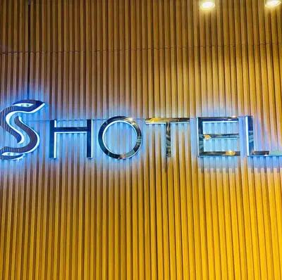 a sign on the side of a building at Hotel S in Manila