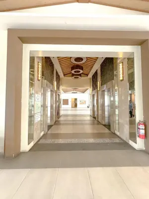 an empty hallway of a building with a hallwayngth at Studio Suite at Fairway Terraces near NAIA T3 in Manila
