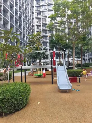 a playground with a slide in a park at shore 2 tower 1 in Manila