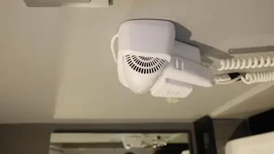a white light on a ceiling in a bathroom at ModernAestheticPicc MoaCcpAirportPool Wi-Fi in Manila