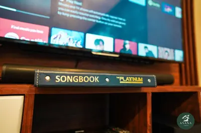 a songbook train sign in front of a television at Asana Amadeo a private villa near Tagaytay in Amadeo