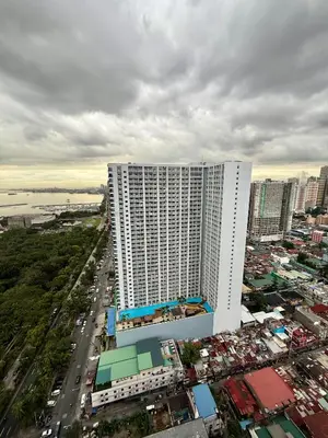 an overhead view of a large white building in a city at Nestled Haven in Manila